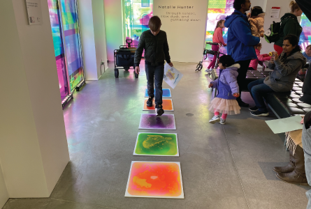 Child standing on a sensory mat during Family Literacy Day